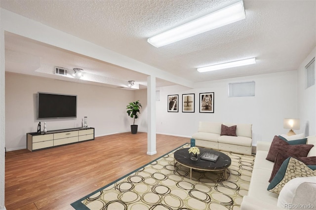 7323 Upham Ct, Arvada, CO 80003 - living room featuring wood finished floors and a textured ceiling