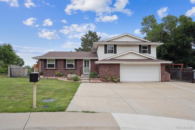 7323 Upham Ct, Arvada, CO 80003 - split level home with a garage, brick siding, and concrete driveway