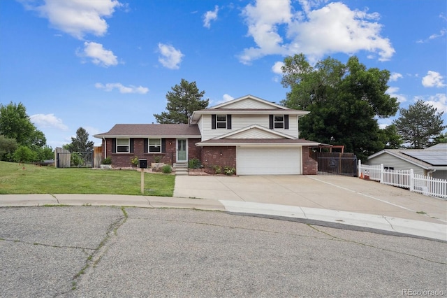 7323 Upham Ct, Arvada, CO 80003 - tri-level home featuring brick siding, driveway, and an attached garage