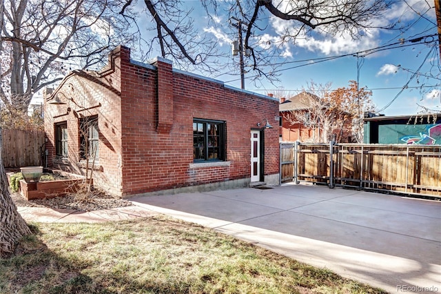 back of property featuring a patio