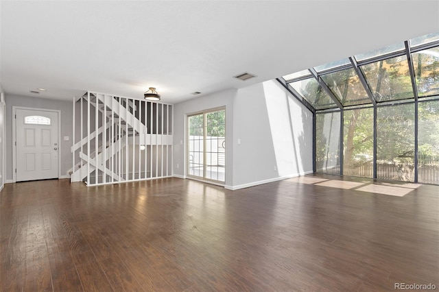 2366 S Troy St, Aurora, CO 80014 - unfurnished living room with stairs and wood finished floors