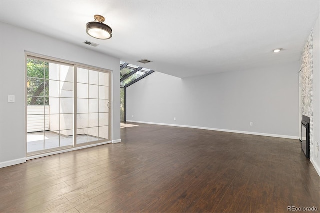 2366 S Troy St, Aurora, CO 80014 - unfurnished living room featuring dark wood-style flooring and a fireplace