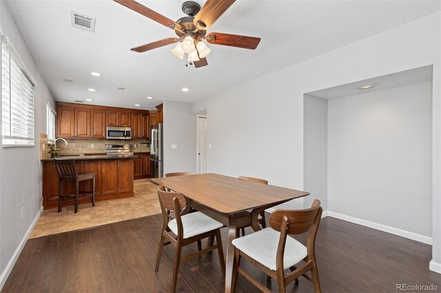 2366 S Troy St, Aurora, CO 80014 - dining room with a ceiling fan, dark wood-style floors, and recessed lighting
