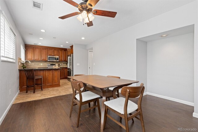 2366 S Troy St, Aurora, CO 80014 - dining area with ceiling fan, dark wood finished floors, and recessed lighting