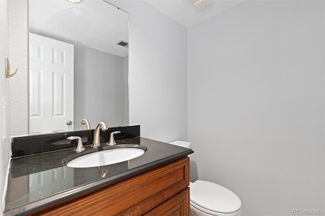 2366 S Troy St, Aurora, CO 80014 - half bathroom featuring vanity and toilet