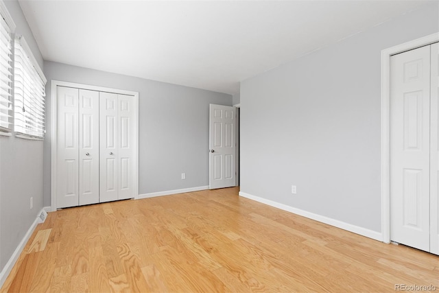 2366 S Troy St, Aurora, CO 80014 - unfurnished bedroom featuring light wood-style flooring and baseboards