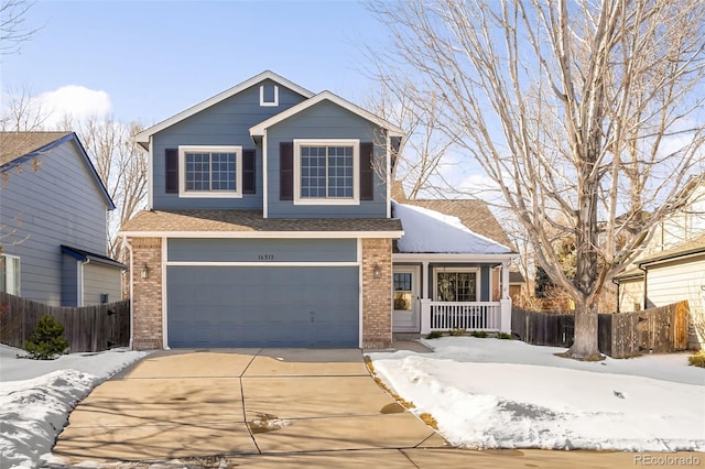 front facade with a garage and covered porch