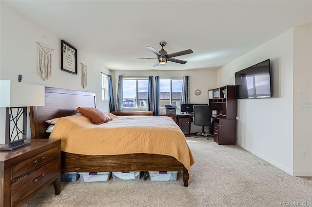 bedroom with a ceiling fan, light colored carpet, and baseboards