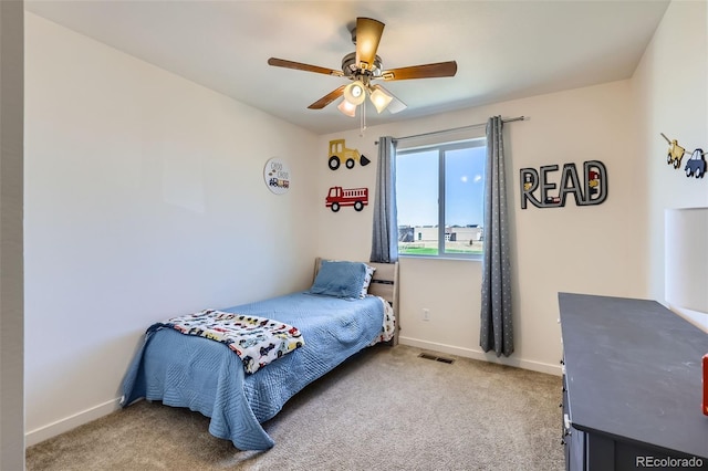 bedroom with light colored carpet, visible vents, and baseboards