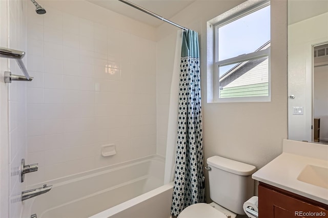 bathroom with toilet, vanity, and shower / tub combo with curtain