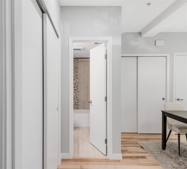 hall with wood finished floors