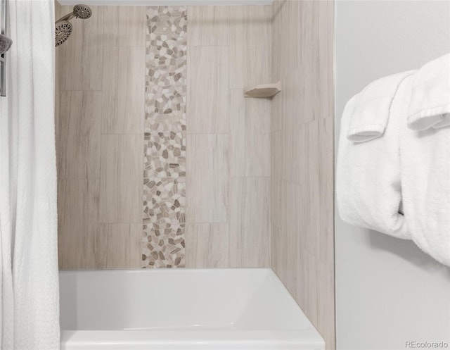 full bathroom featuring tiled shower / bath