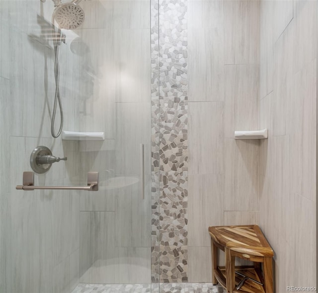 full bathroom with a tile shower