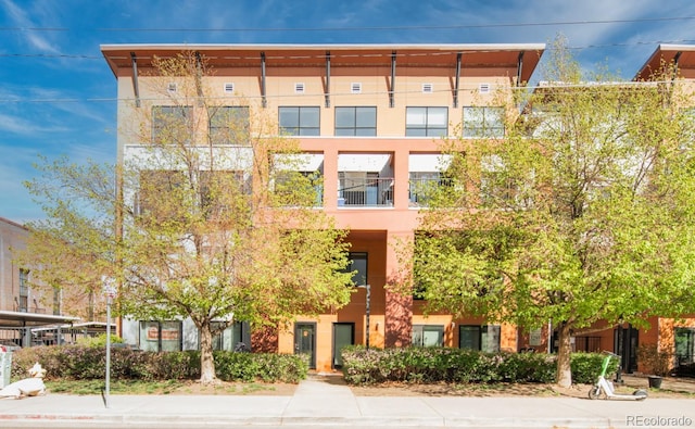 3295 Blake St Unit 102, Denver, CO 80205 - view of apartment building / complex