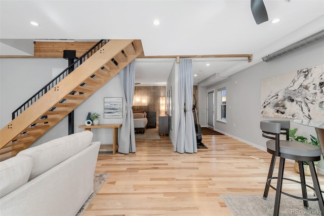 3295 Blake St Unit 102, Denver, CO 80205 - living room with recessed lighting, wood finished floors, stairway, and baseboards