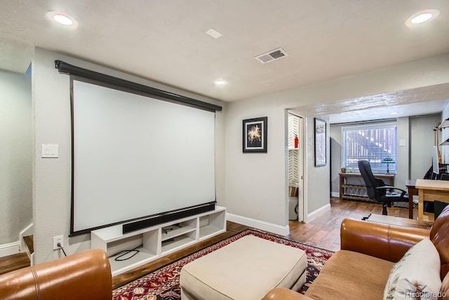 home theater room featuring light hardwood / wood-style flooring