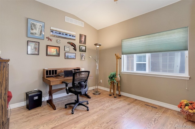 14879 Xenia St, Thornton, CO 80602 - home office featuring light wood-type flooring, lofted ceiling, and baseboards