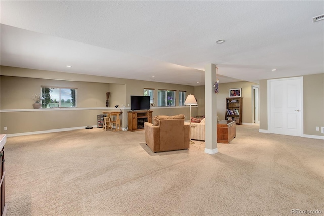 14879 Xenia St, Thornton, CO 80602 - living room featuring light carpet, baseboards, and recessed lighting