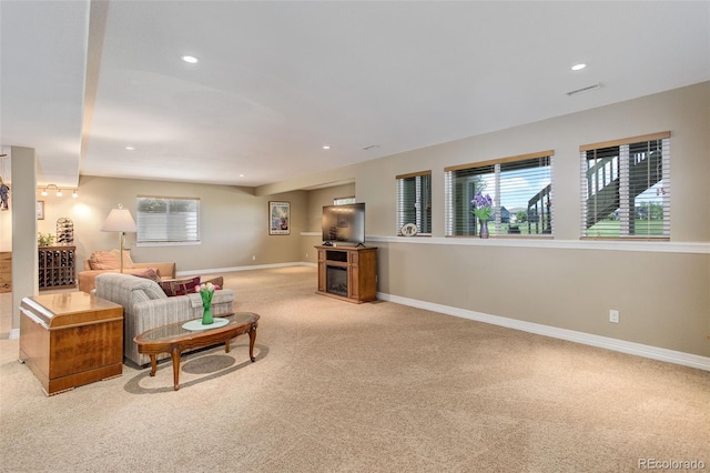14879 Xenia St, Thornton, CO 80602 - carpeted living area with baseboards and recessed lighting