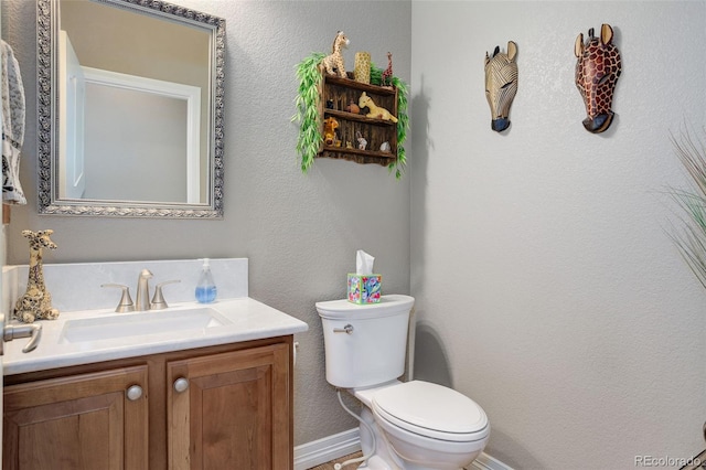 14879 Xenia St, Thornton, CO 80602 - bathroom featuring toilet, vanity, and baseboards