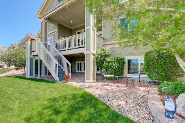14879 Xenia St, Thornton, CO 80602 - back of house with a yard, a patio area, stairway, and a wooden deck