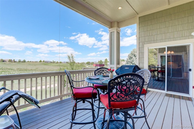 14879 Xenia St, Thornton, CO 80602 - wooden terrace featuring area for grilling and outdoor dining area