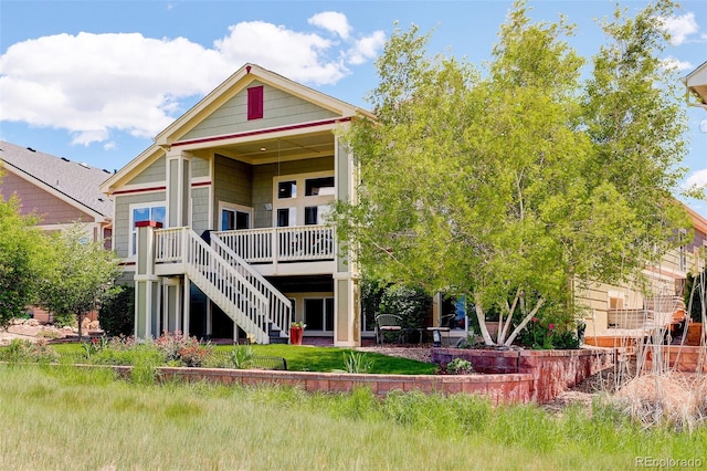 14879 Xenia St, Thornton, CO 80602 - back of property with a wooden deck and stairs