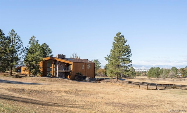 view of front of property featuring a rural view