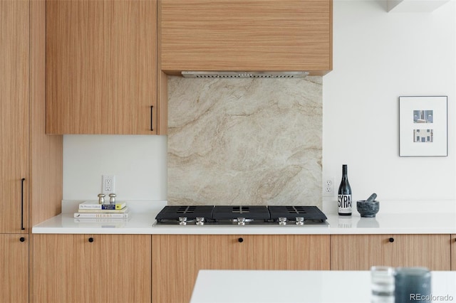 kitchen with black gas cooktop and backsplash