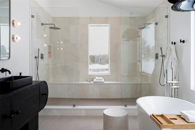 bathroom featuring vanity, independent shower and bath, and tile patterned flooring