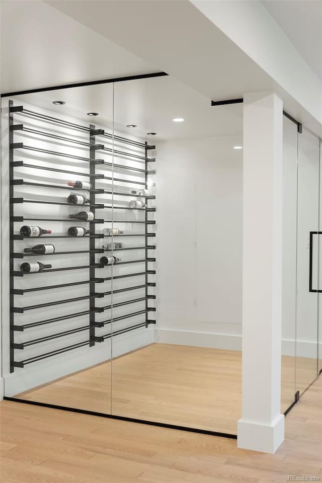 wine area with light wood-type flooring