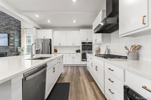17121 Desert Wine Ln, Parker, CO 80134 - kitchen with appliances with stainless steel finishes, wall chimney range hood, a sink, decorative backsplash, and light countertops
