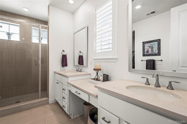 17121 Desert Wine Ln, Parker, CO 80134 - full bathroom with vanity, a stall shower, recessed lighting, and wood finished floors
