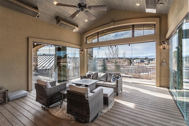 sunroom featuring wood ceiling, ceiling fan, and lofted ceiling