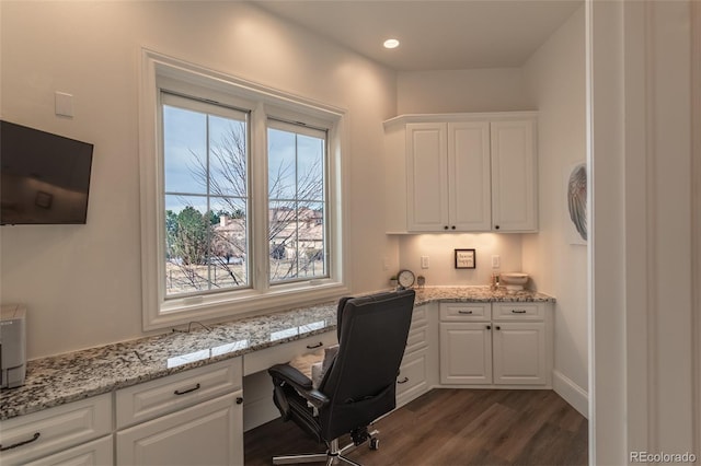 office featuring dark wood-type flooring and built in desk