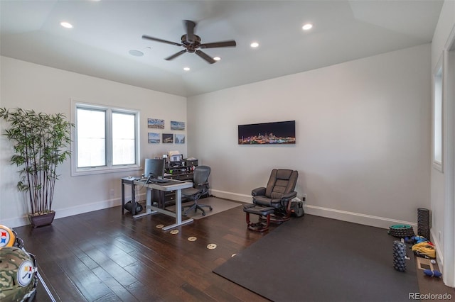 office featuring ceiling fan, dark wood-type flooring, and lofted ceiling