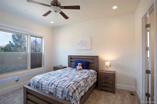 bedroom with ceiling fan and carpet floors