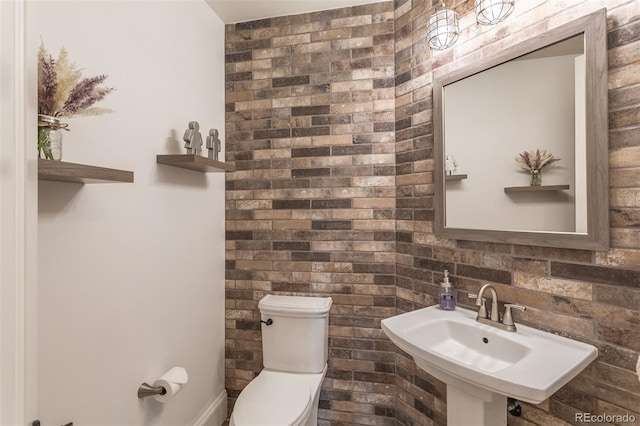 bathroom featuring sink and toilet