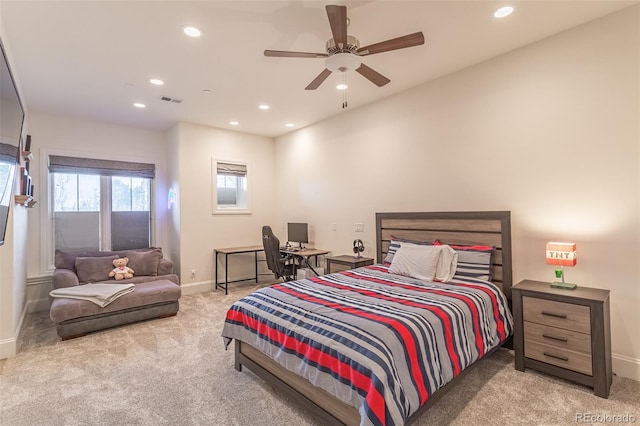 bedroom with ceiling fan and light colored carpet