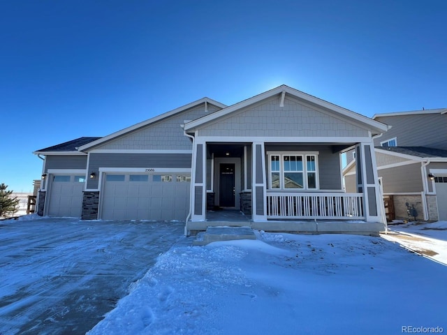 craftsman-style house with a garage and covered porch