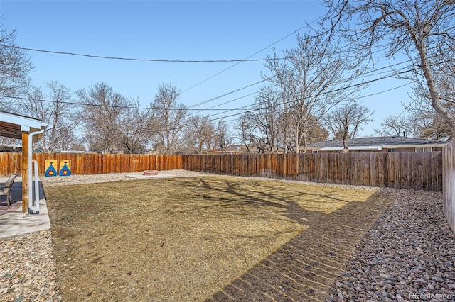 view of yard with a patio area and a fenced backyard