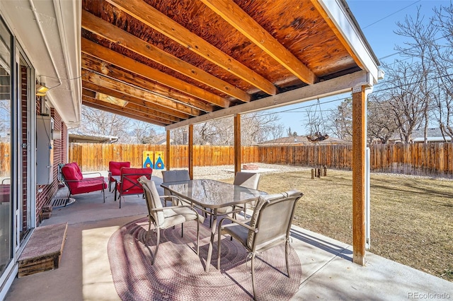 view of patio / terrace with outdoor dining area and a fenced backyard