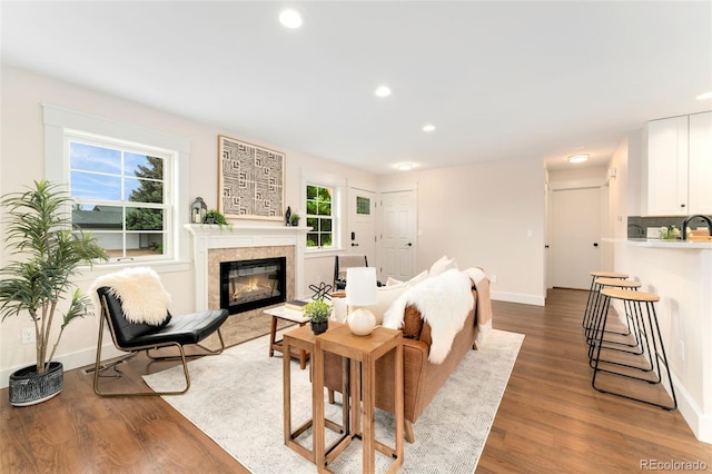 13483 Alcott Way, Broomfield, CO 80020 - living room with wood finished floors, recessed lighting, baseboards, and a fireplace