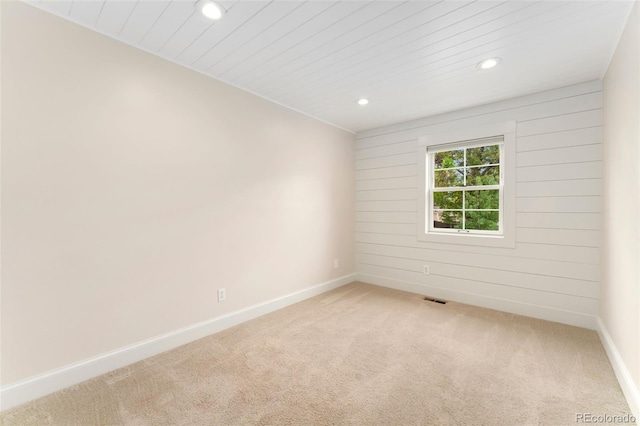 13483 Alcott Way, Broomfield, CO 80020 - spare room featuring recessed lighting, light colored carpet, baseboards, wooden walls, and wooden ceiling