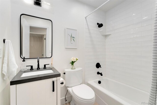 13483 Alcott Way, Broomfield, CO 80020 - bathroom with toilet, vanity, and bathing tub / shower combination
