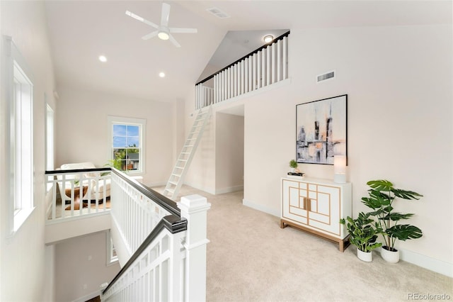 13483 Alcott Way, Broomfield, CO 80020 - stairway with high vaulted ceiling, carpet flooring, ceiling fan, and baseboards