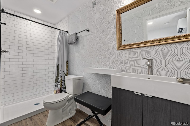 bathroom featuring toilet, a wall mounted AC, vanity, and walk in shower