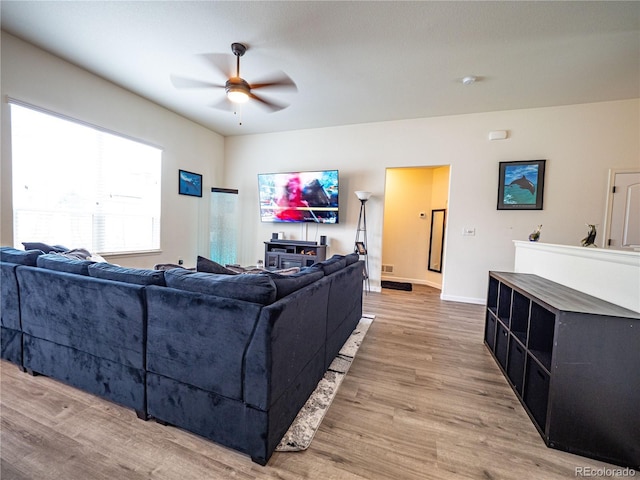 8809 15th Street Rd, Greeley, CO 80634 - living area with a ceiling fan, light wood-type flooring, and baseboards