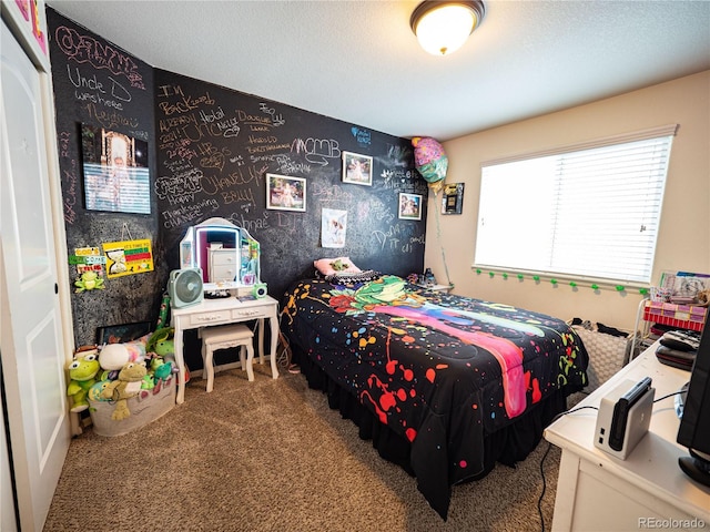 8809 15th Street Rd, Greeley, CO 80634 - bedroom featuring carpet flooring, wallpapered walls, and a textured ceiling