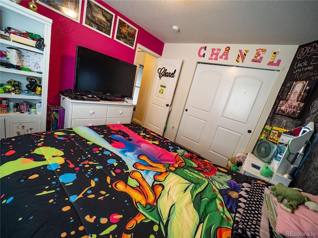 8809 15th Street Rd, Greeley, CO 80634 - bedroom with a closet and a textured ceiling